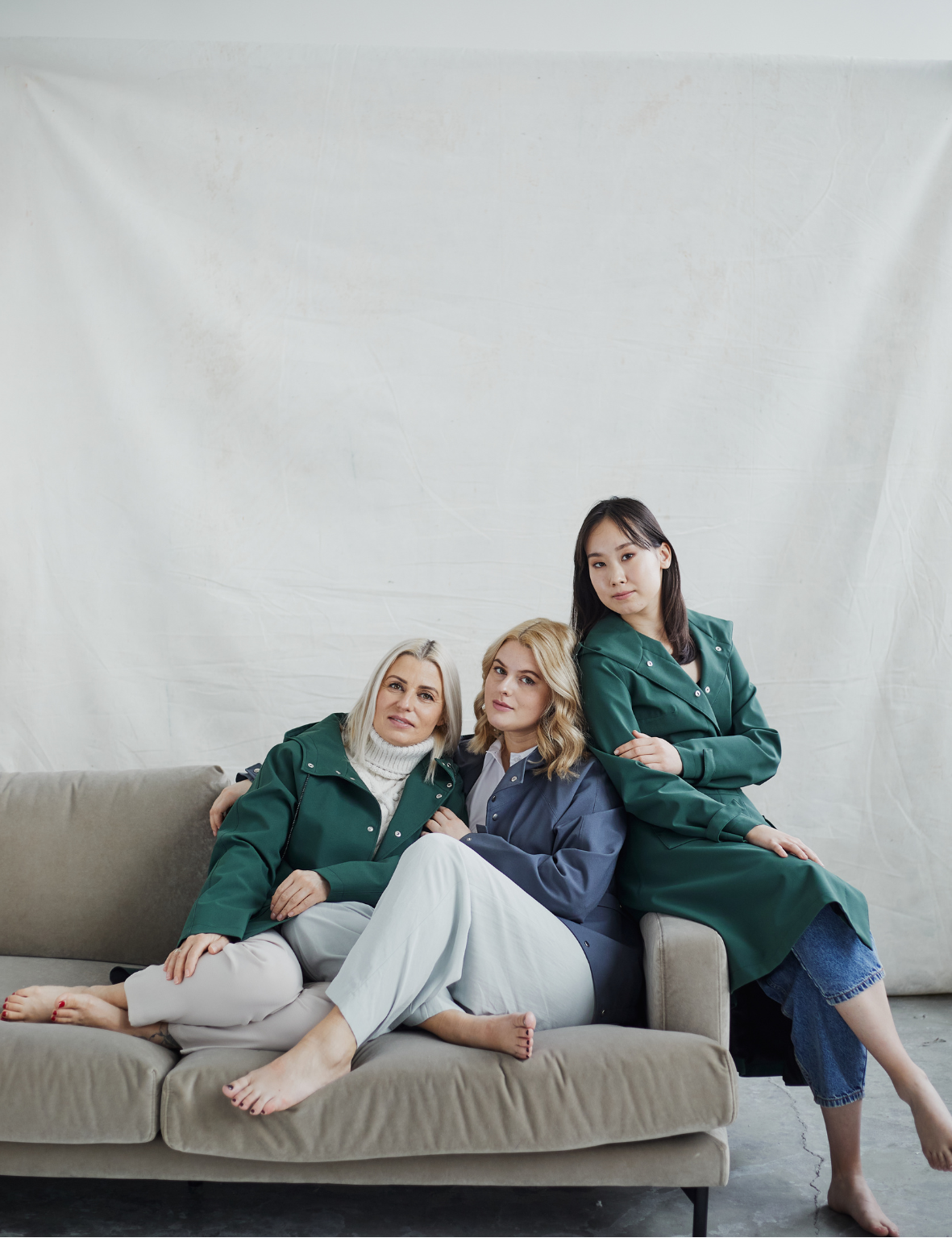 Three woman sitting on the sofa